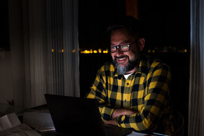 Young man using laptop at home