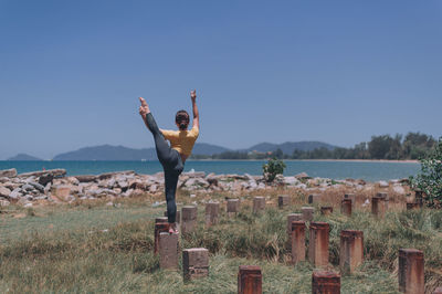 Man standing at observation point against sky