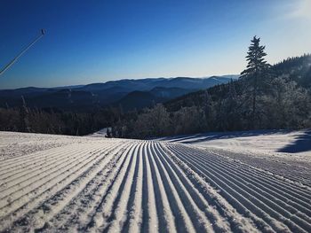 View of snow field against sky