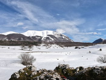 Scenic view of snowcapped mountains against sky