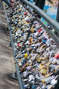 Padlocks on bridge railing