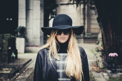 Portrait of young woman wearing hat