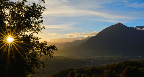 Scenic view of silhouette mountains against sky at sunset