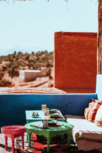 Close-up of food on table at beach against clear sky