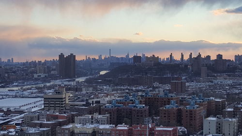 Cityscape against sky during sunset