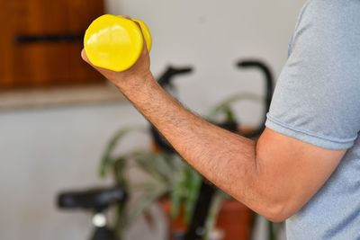Close-up of man working in tray