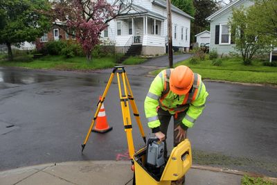 Man working on road by building