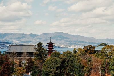 High section of pagoda against cloudy sky