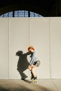 Full length of woman with umbrella