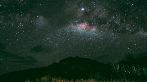 Scenic view of star field against sky at night