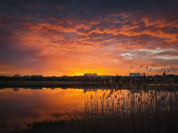 Colorful and dramatic sunset sky reflecting on pond water. silent evening scene at delia lake