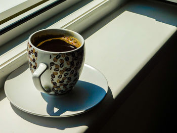 Close-up of coffee cup on table