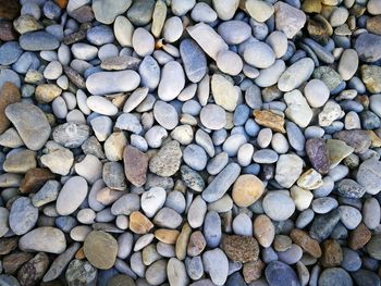 Full frame shot of pebbles at beach