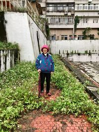 Full length of boy walking on built structure