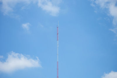 Low angle view of communications tower against sky