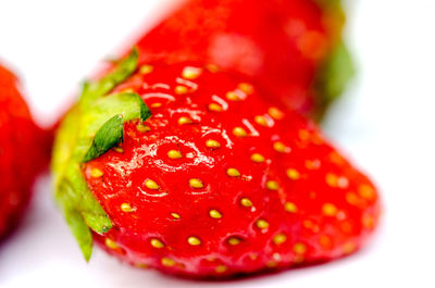 Close-up of strawberries on white background