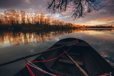 Scenic view of lake against sky at sunset