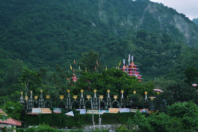 Temple against trees and mountains