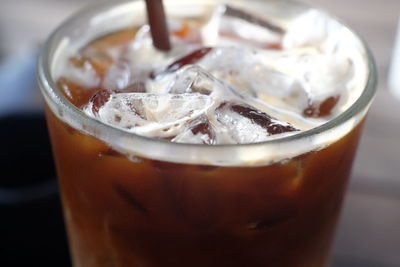 Close-up of iced coffee in glass