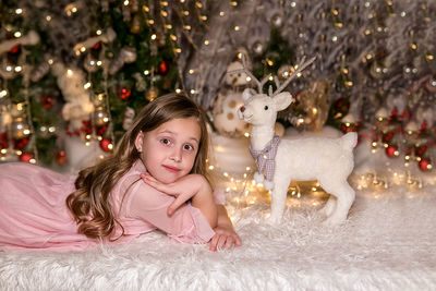 Portrait of girl with christmas tree