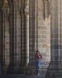 Woman standing outside building