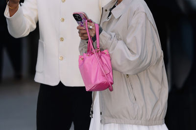 Midsection of woman holding gift