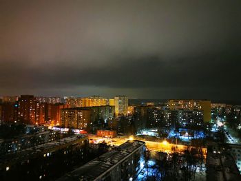 High angle view of illuminated buildings in city at night