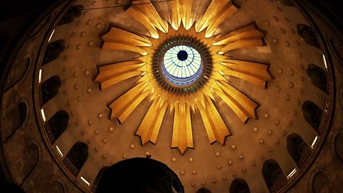 Low angle view of illuminated ceiling in building