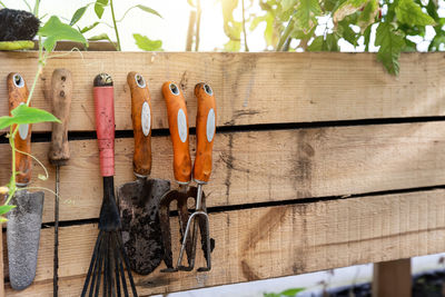 High angle view of work tools on wooden wall