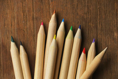 Close-up of multi colored pencils on table