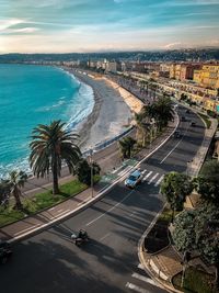 High angle view of road amidst city and sea