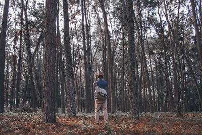 Woman standing in forest