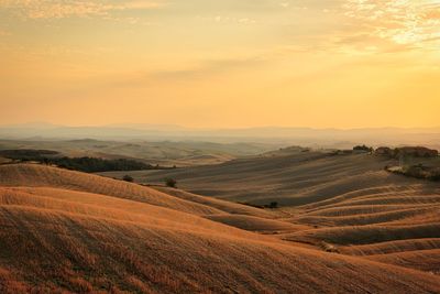 Scenic view of landscape against sky during sunset