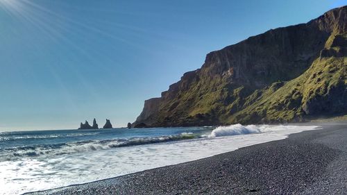 Scenic view of sea against blue sky