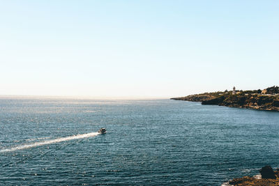 Scenic view of sea against clear sky