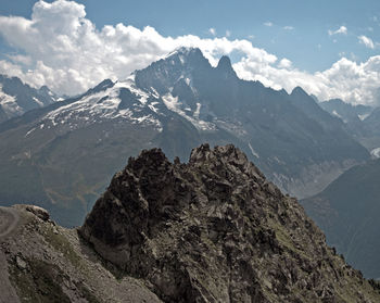 Scenic view of snowcapped mountains against sky