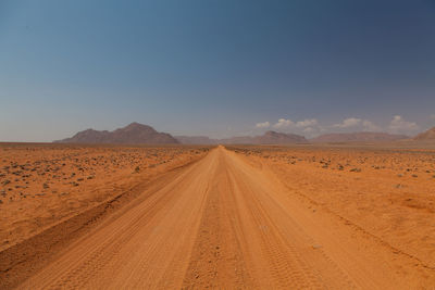 Scenic view of desert against clear sky