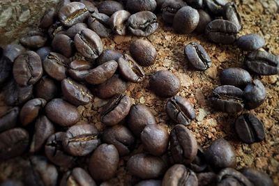 Close-up of roasted coffee beans on table