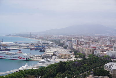 High angle view of buildings and trees against sky