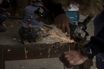 Sparks flying from power tool on iron