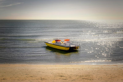 Boat in sea against sky