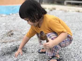 Full length of cute girl playing outdoors