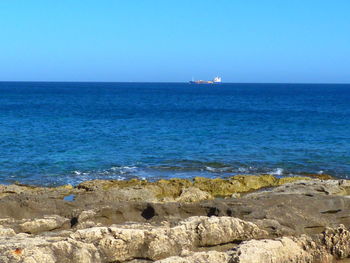 Scenic view of sea against clear sky