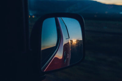 Reflection of car on side-view mirror