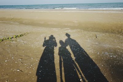 Shadow of people at beach