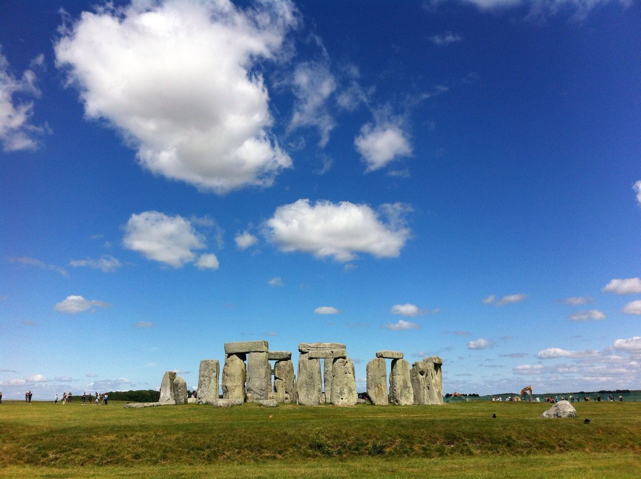 grass, sky, built structure, architecture, blue, field, history, building exterior, cloud - sky, landscape, old ruin, cloud, the past, ancient, old, day, tranquility, travel destinations, outdoors, no people