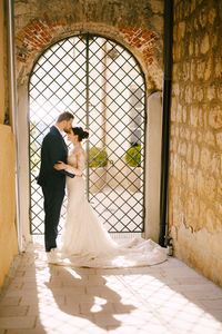 Couple standing in corridor