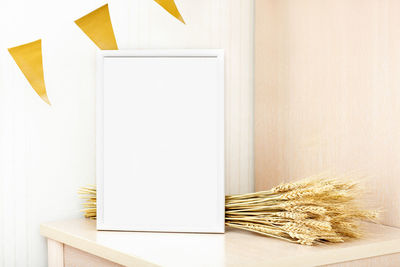 White frame with copy space and barley spiklets.  inspirational text mockup. seasonal party, 