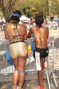 Rear view of couple standing in swimming pool