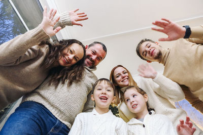 Portrait of smiling friends enjoying at home